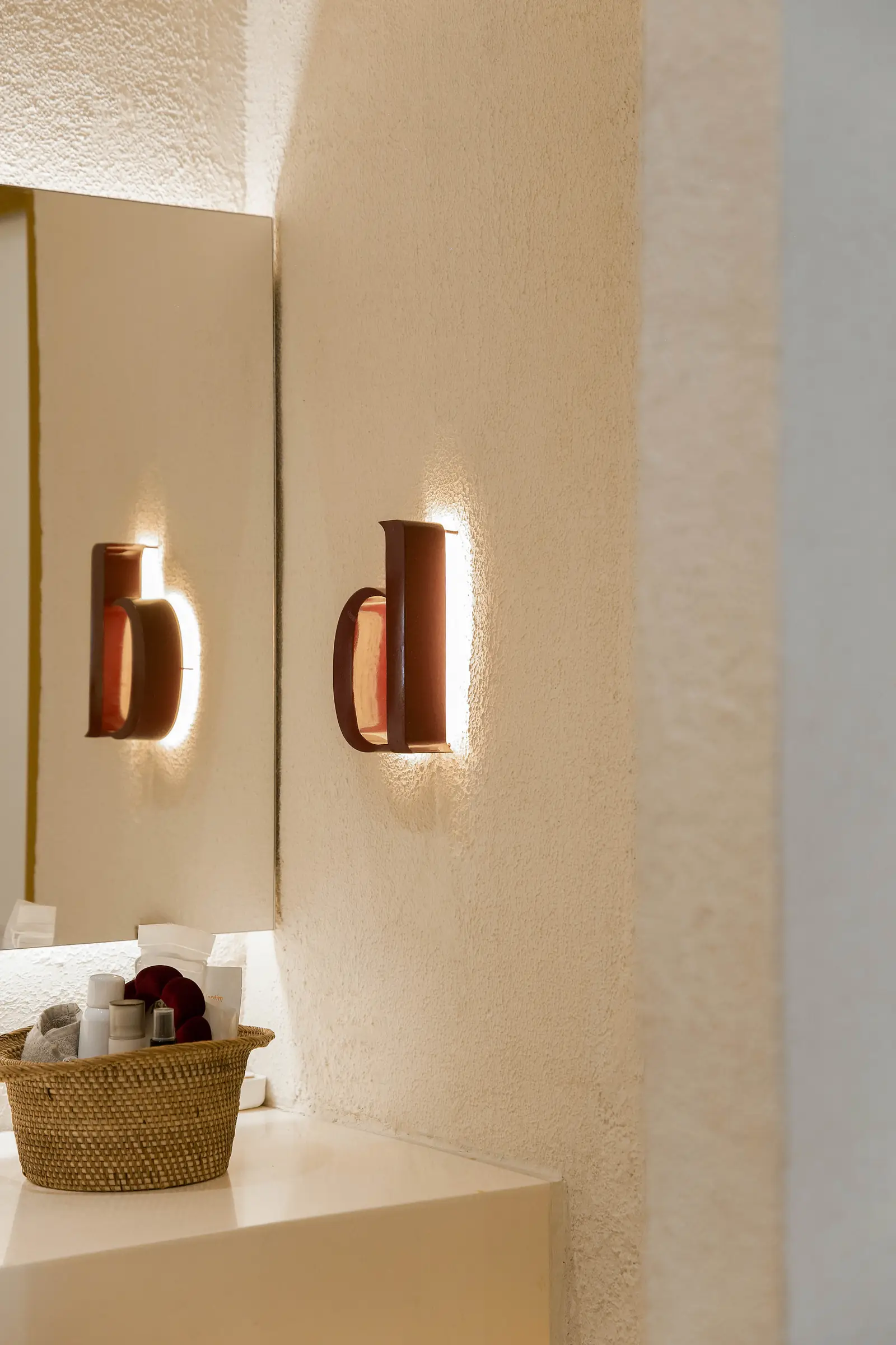 The reception area, with the Day wall light above the basket of towels