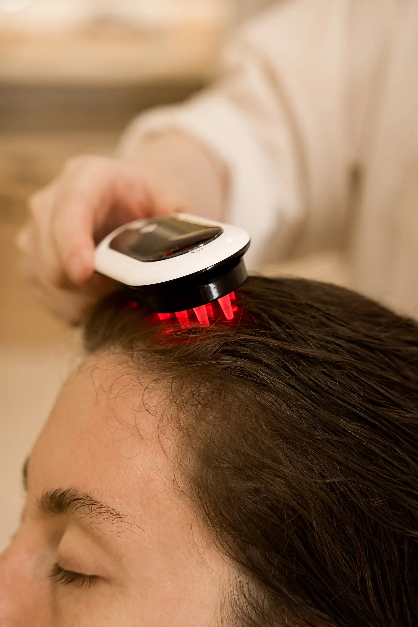 Red LED light therapy at the scalp