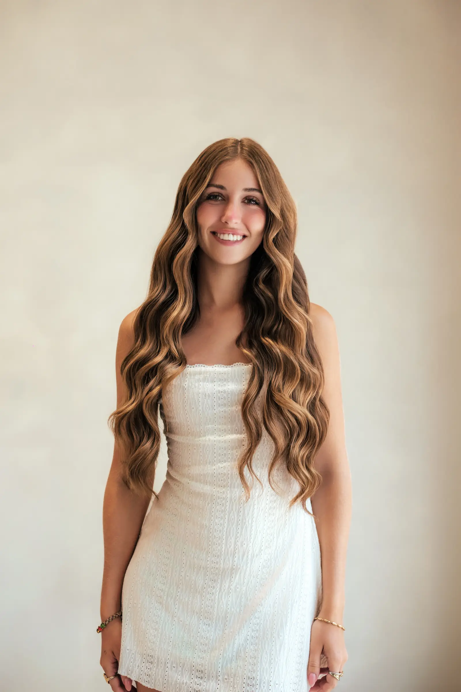 Long blonde hair styled into natural beach waves at Day Hair Habit in Bali