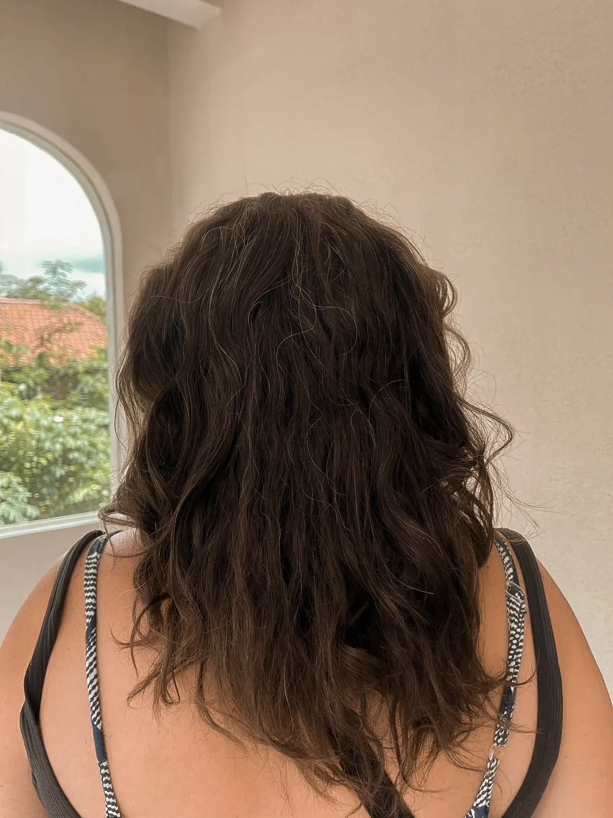 Thick, dark, wavy hair before an Intense Hair Keratin treatment