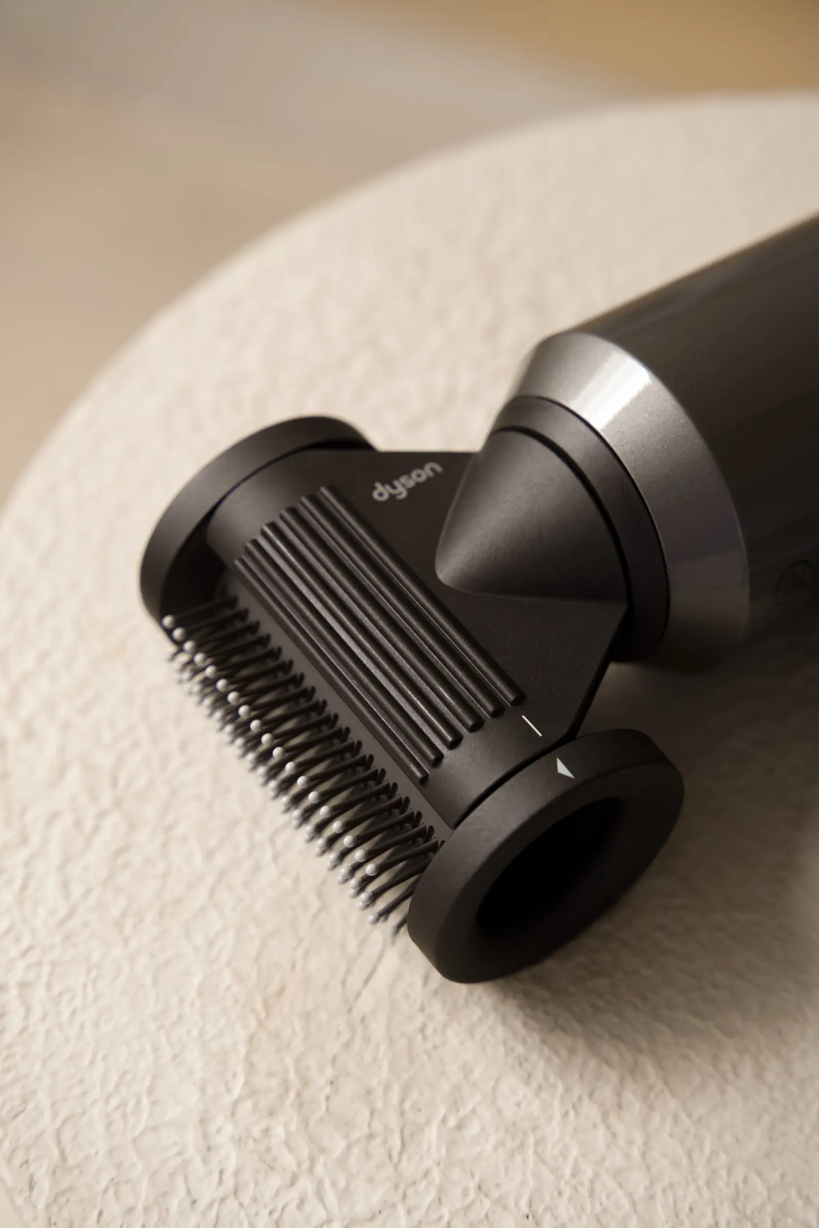 The Dyson flyaway attachment smoothing hair and taking down frizz at Day Hair Habit