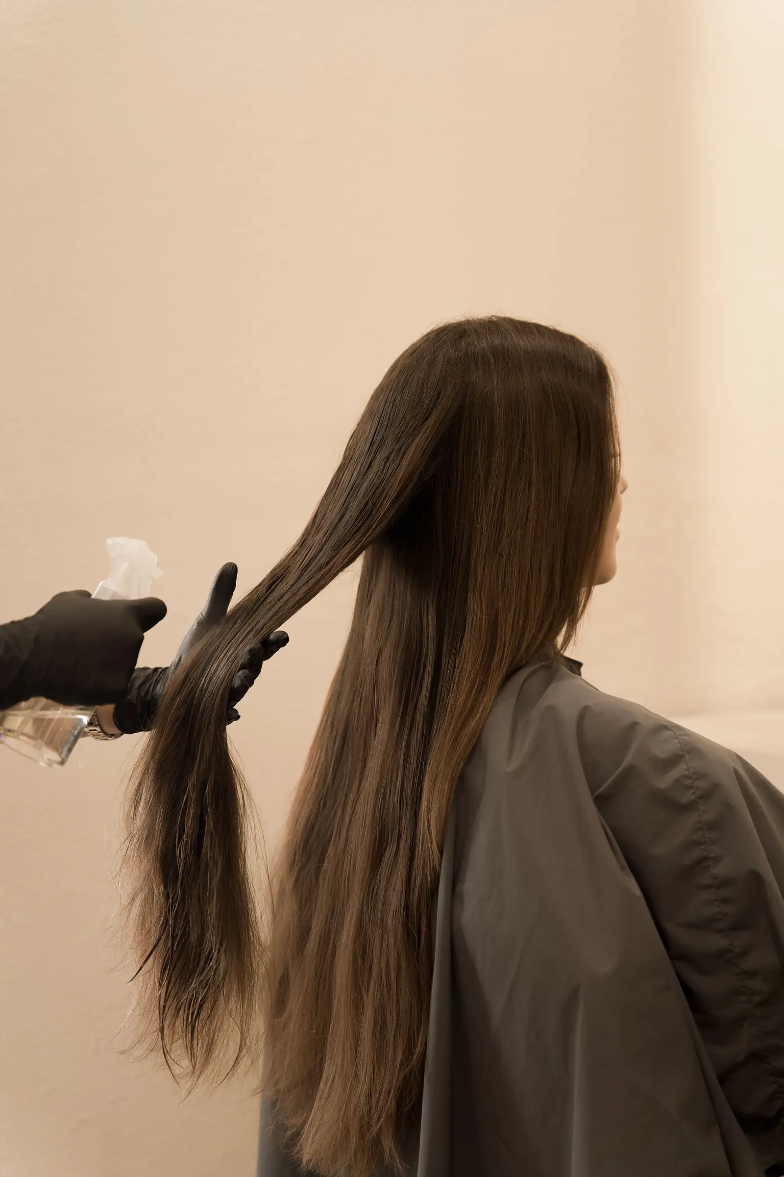 Hair sprayed down before cutting